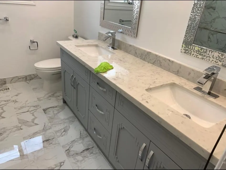 Grey shaker double vanity with quartz countertop